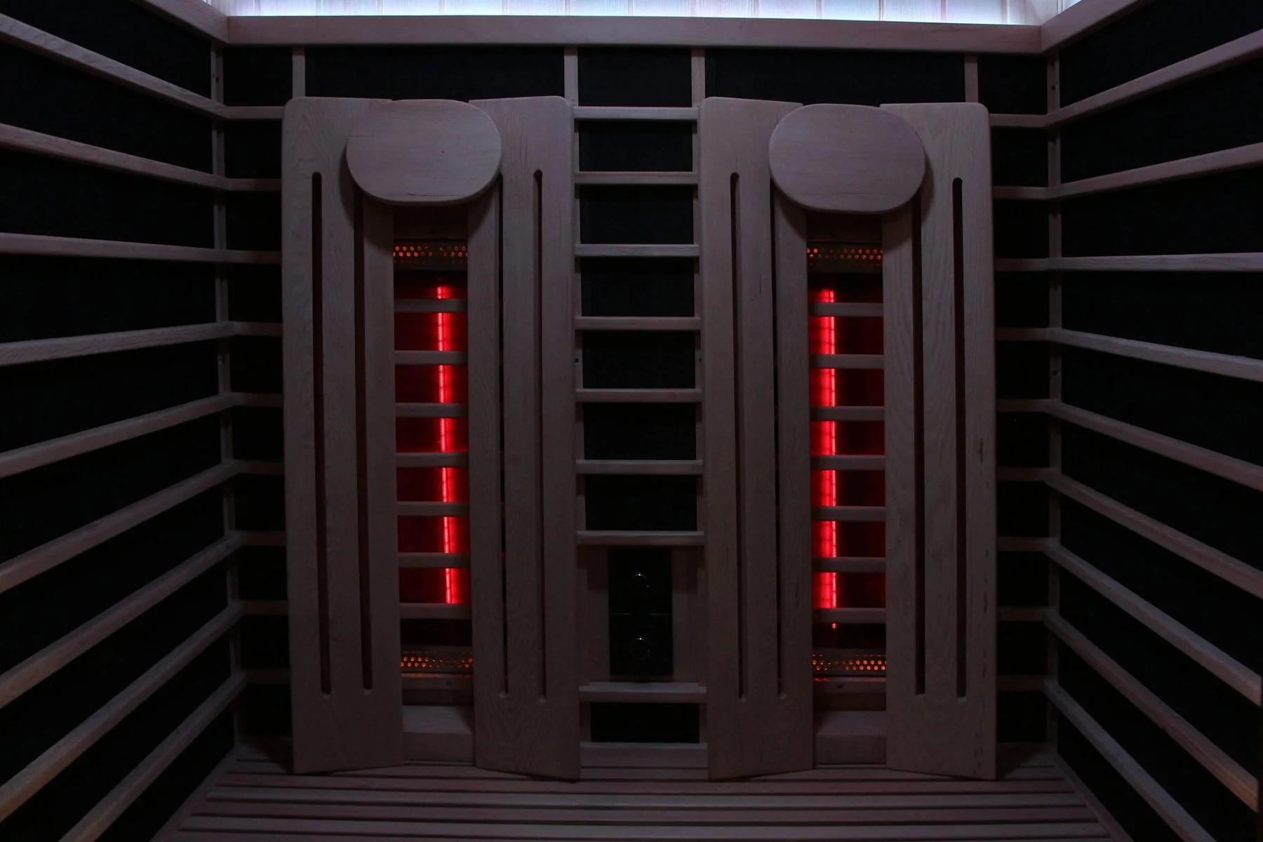 Wooden backrests over the heaters inside the Sun Home Eclipse