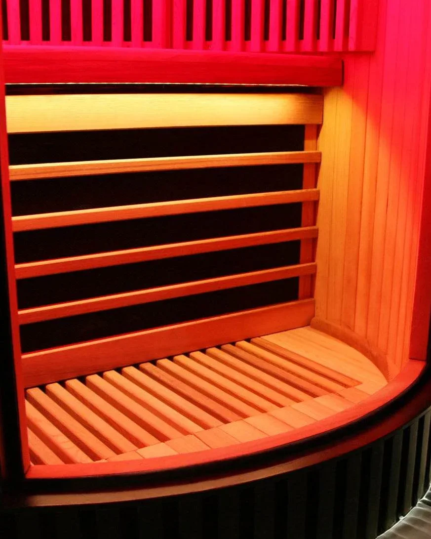 Curved wood bench and floor grate inside the Sun Home Pod