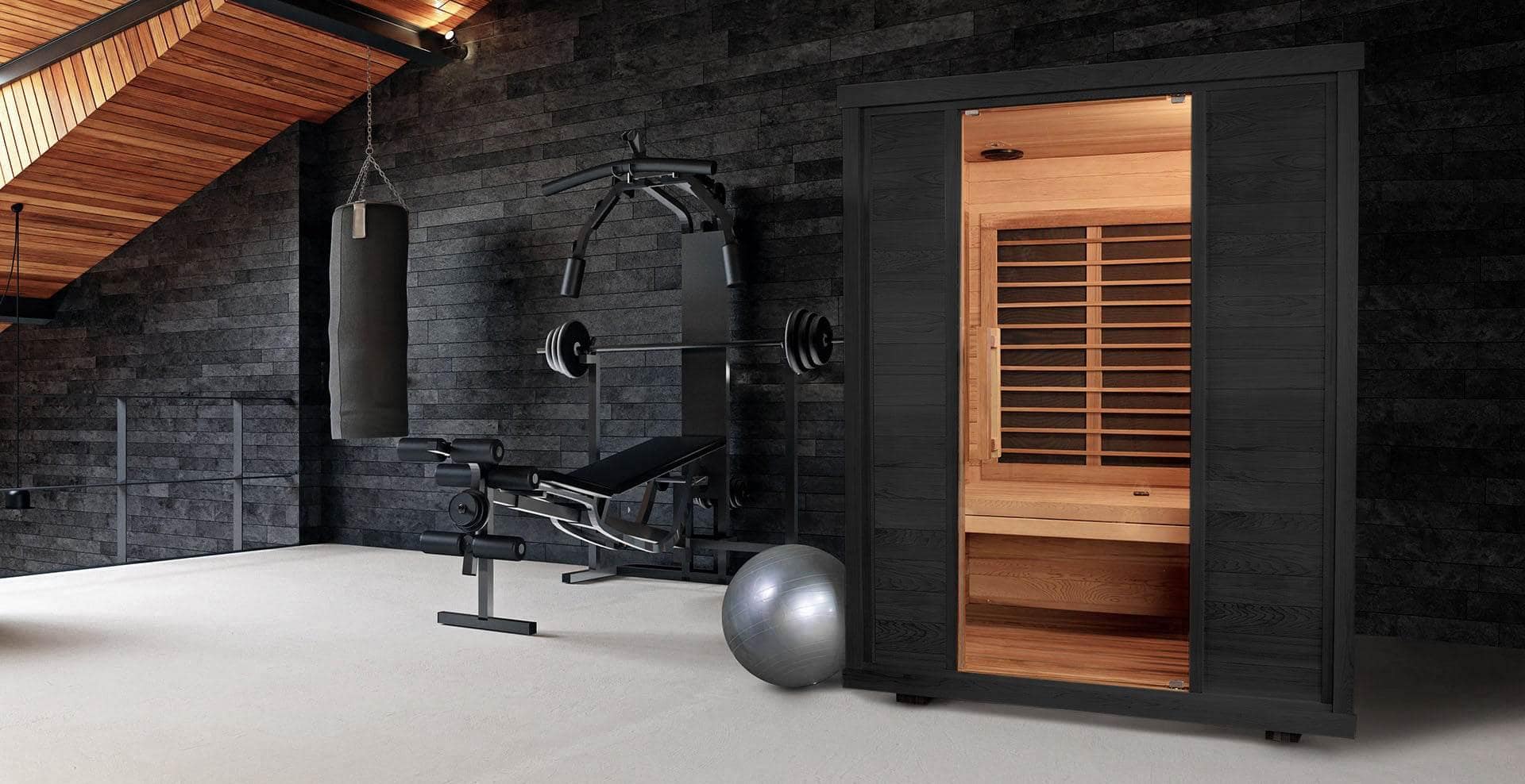 Sun Home Equinox infrared sauna in a dark home gym