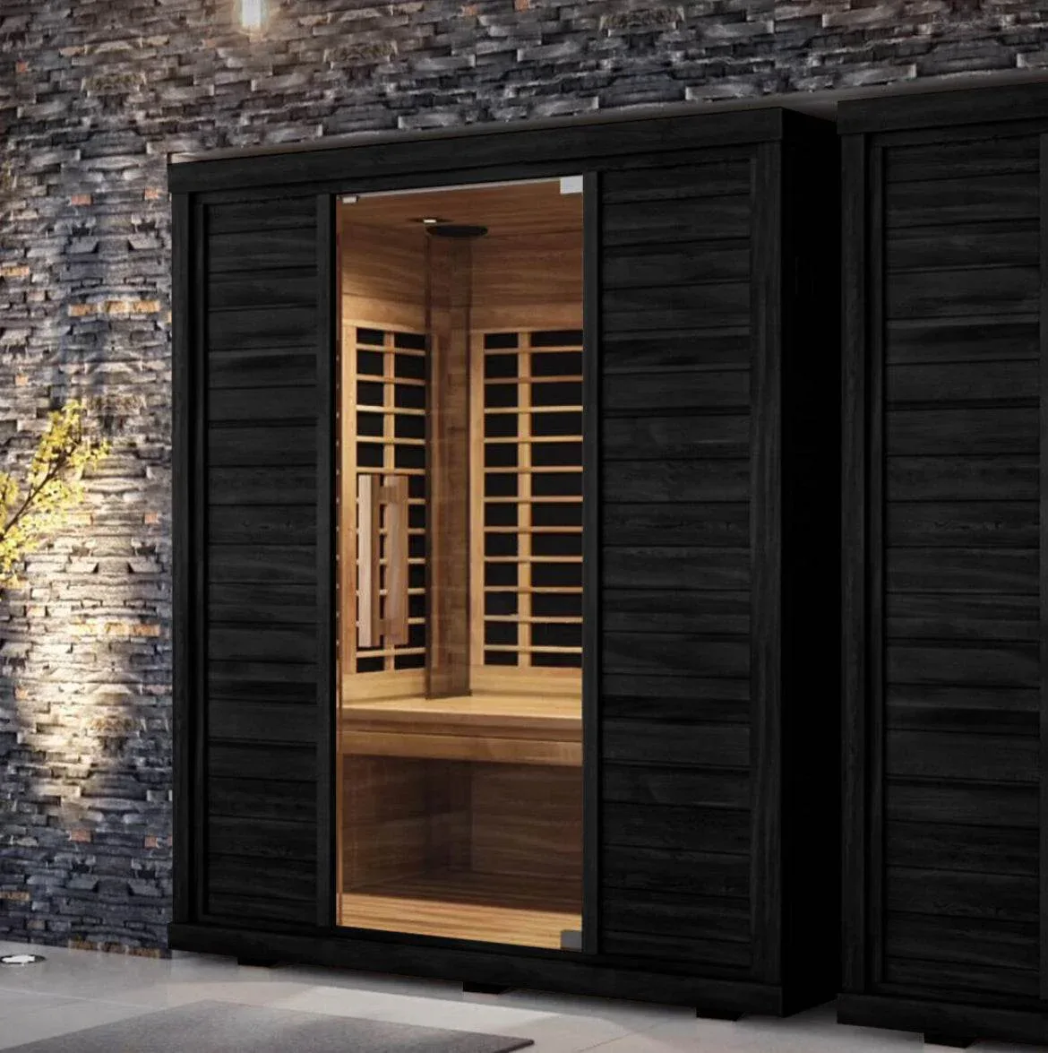 Sun Home Equinox 2-Person sauna against a black stone wall