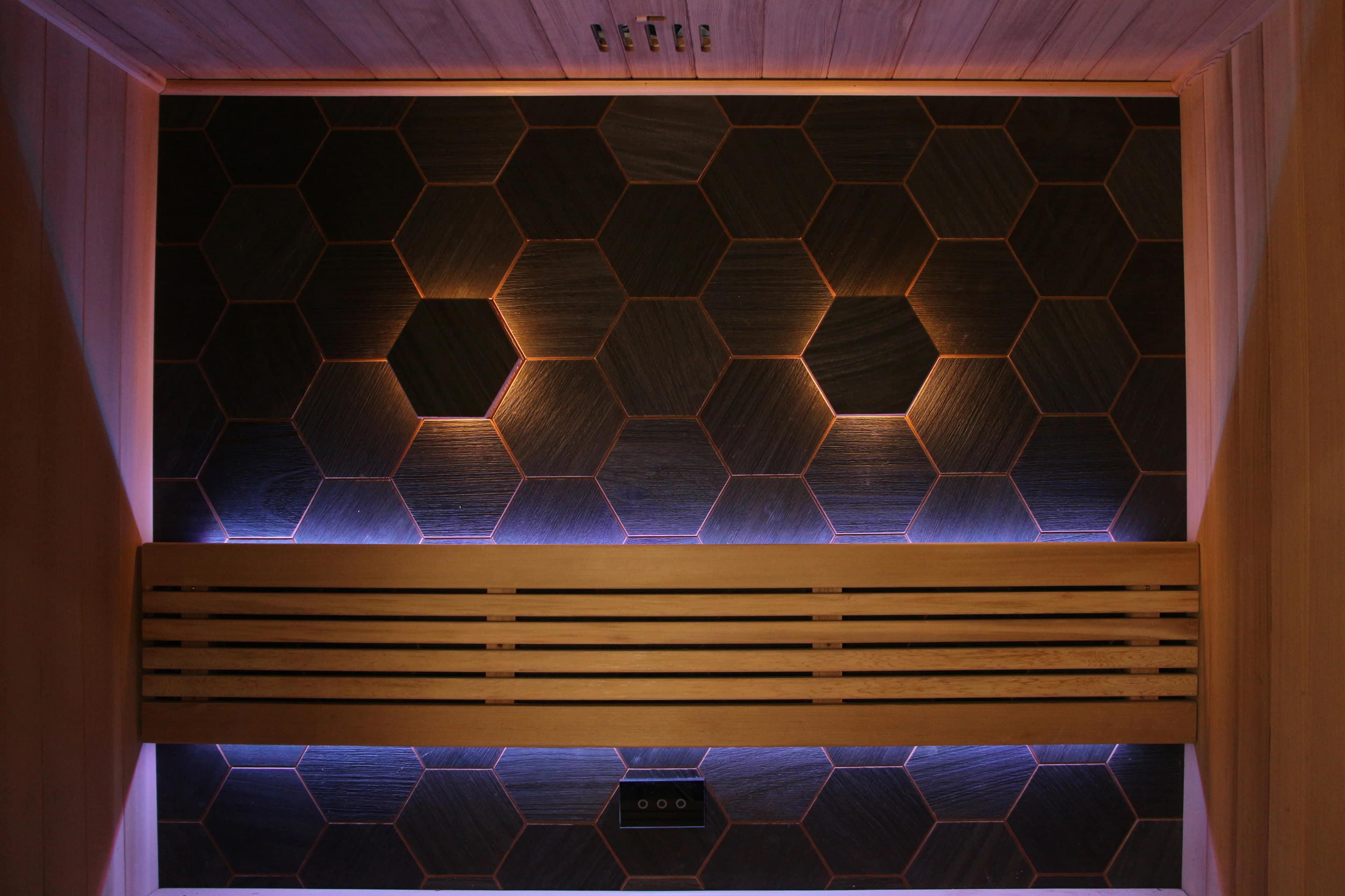 Hex tile back wall and bench inside the Sun Home Nova 3-Person