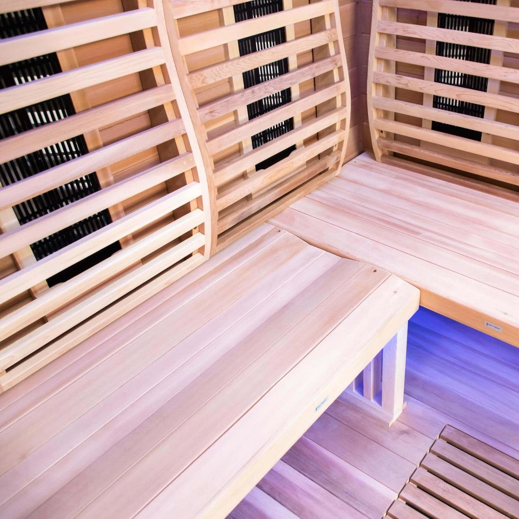 L-shaped red cedar bench inside the Sun Home Luminar 2-Person