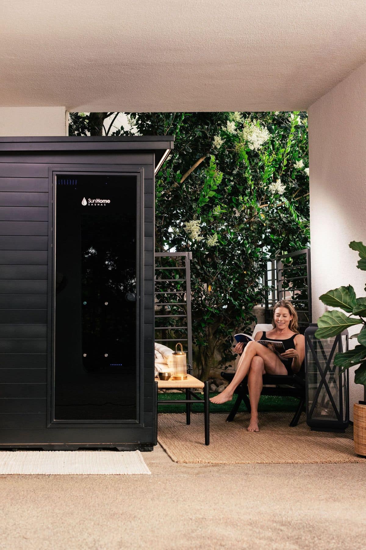 Sun Home Luminar 2-Person on a covered patio with plants
