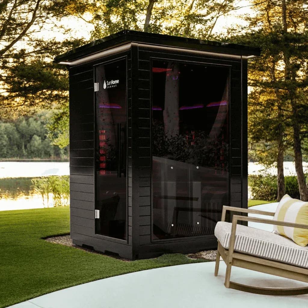 Sun Home Luminar 2-Person by a lake beside an outdoor sofa